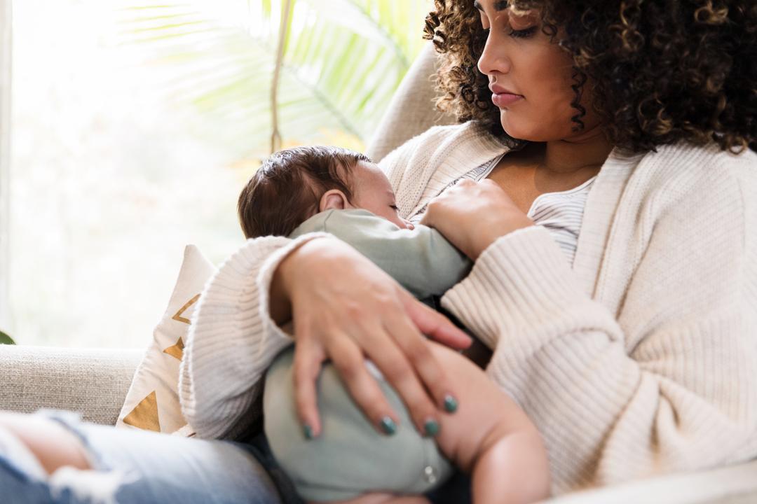 woman breastfeeding her baby
