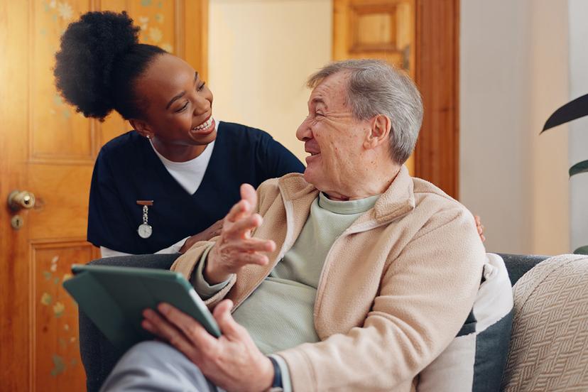 caretaker-with-happy-elderly-man