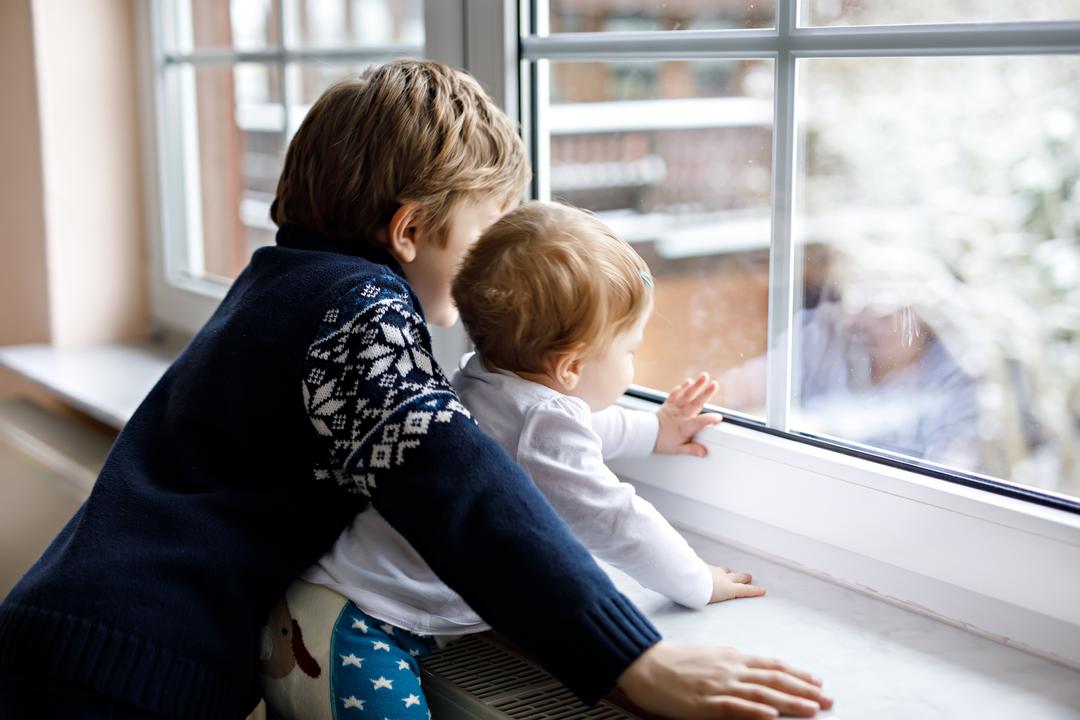 kids looking out a window