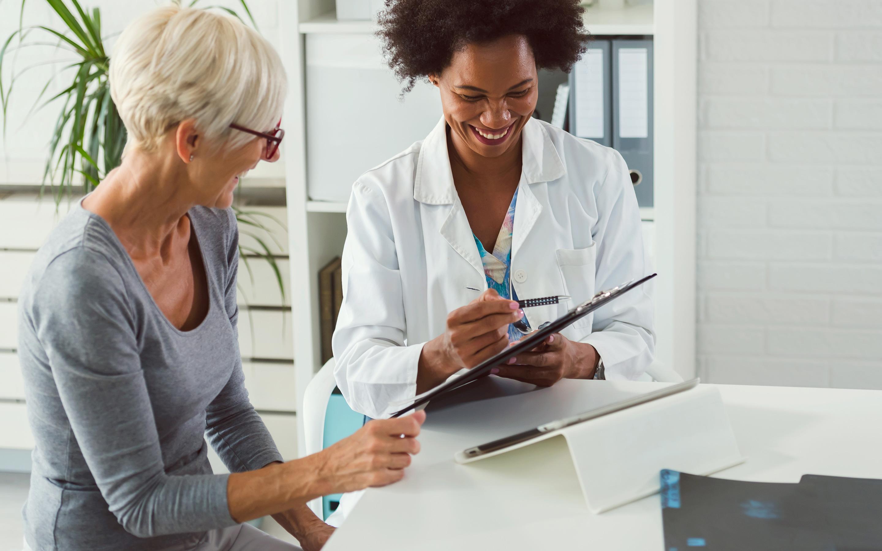 Doctor and patient discussing notes