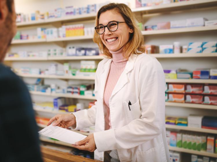 female pharmacist with patient