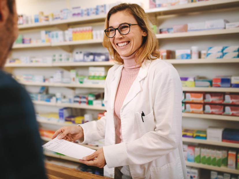 female pharmacist with patient