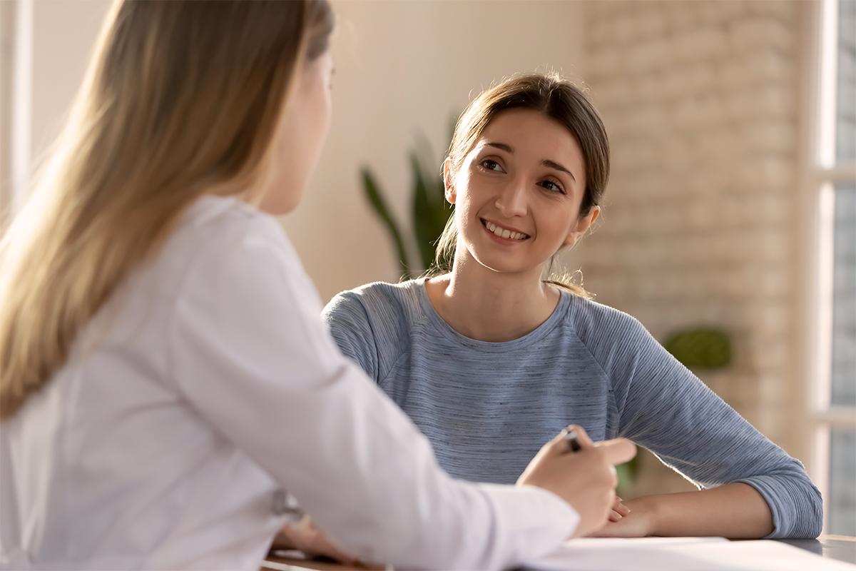 Woman at home talking to a doctor