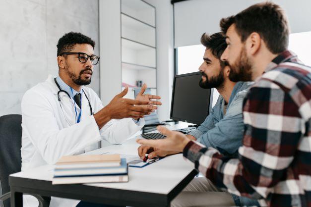 two men seeing the doctor in the office
