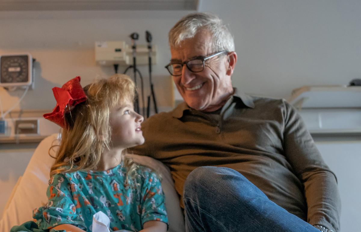 hospital patient with a bedside visitor
