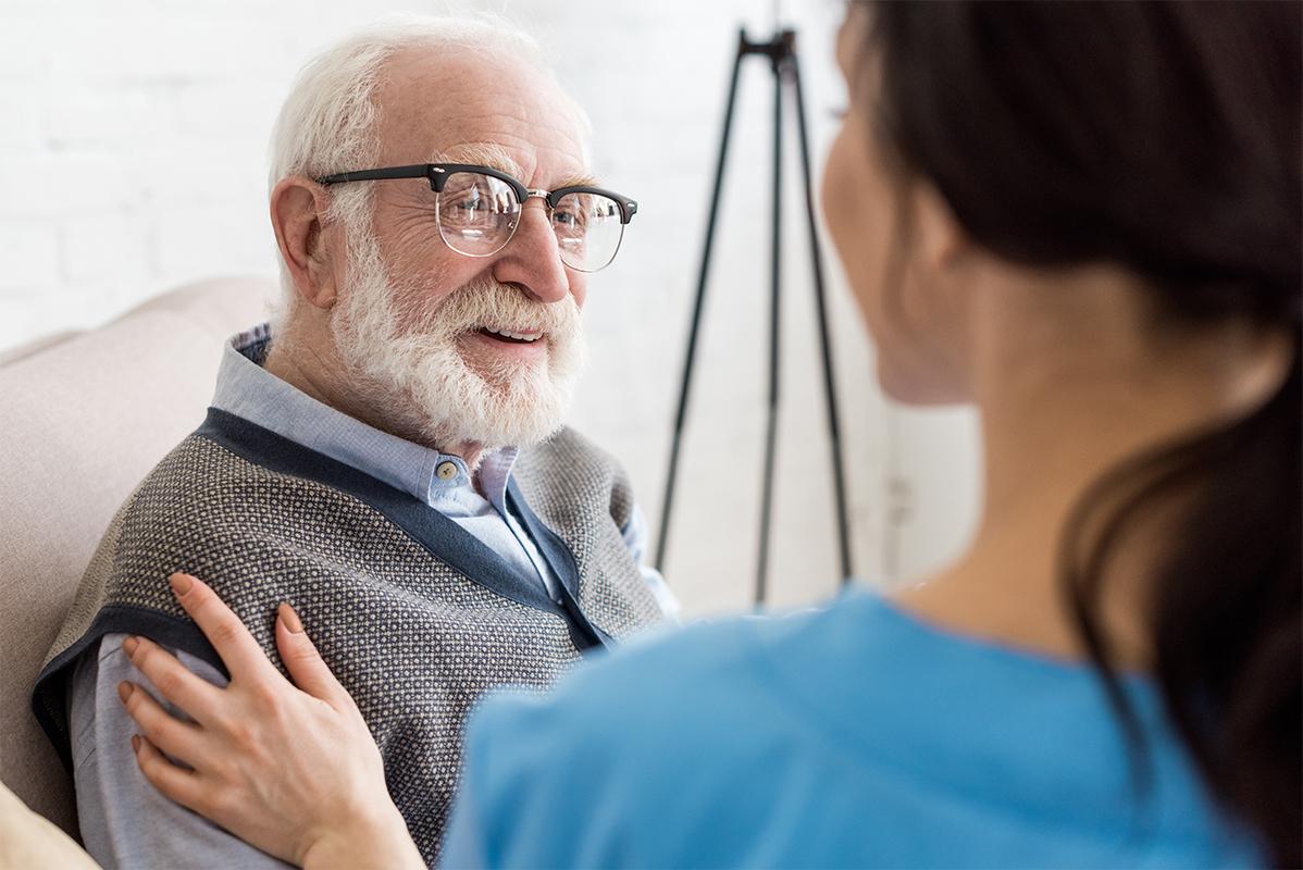 grey haired man with nurse