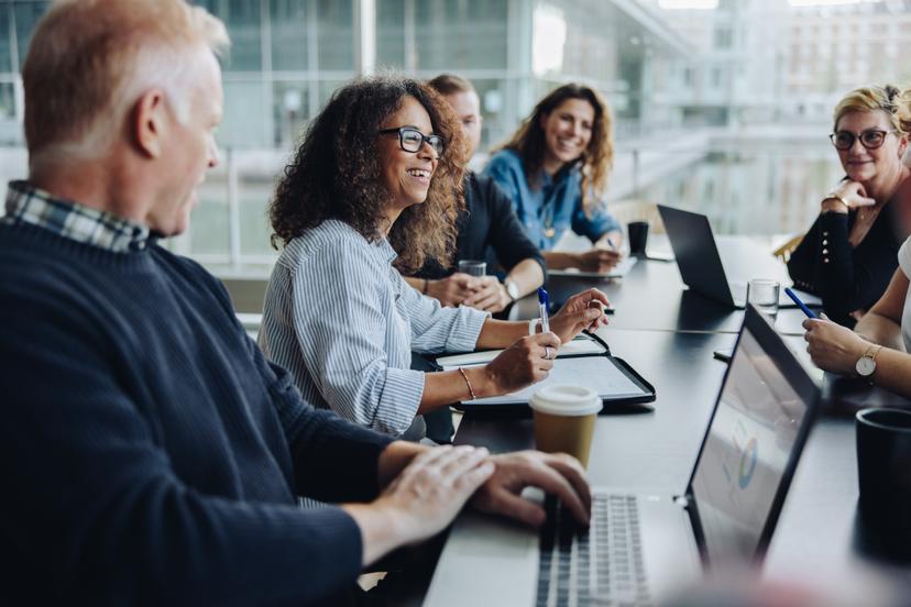 group of business people sitting at table