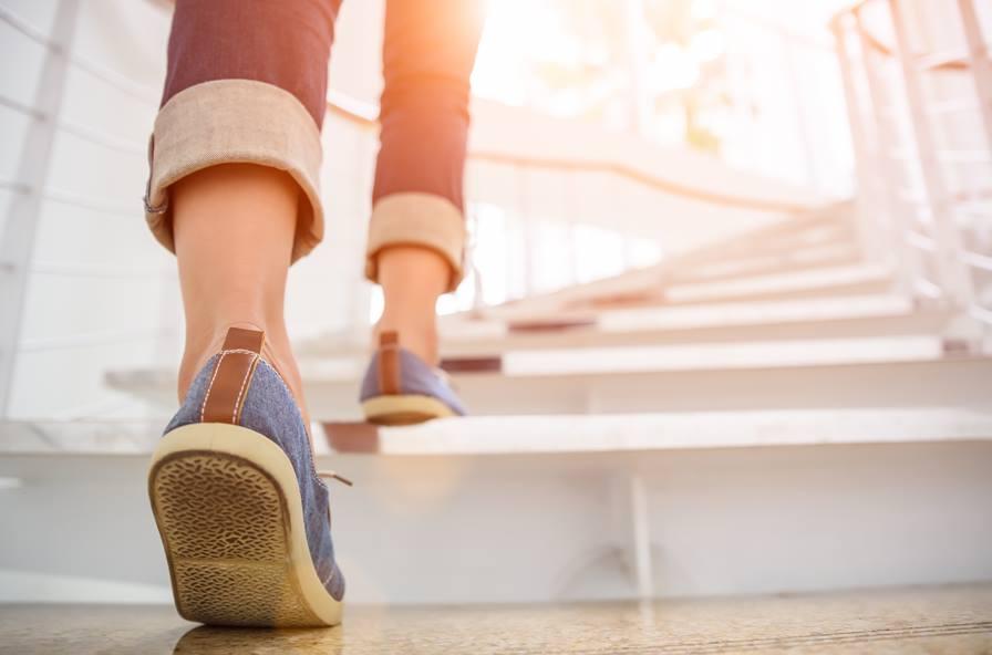 Person walking up stairs