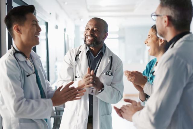 group of physicians talking and laughing