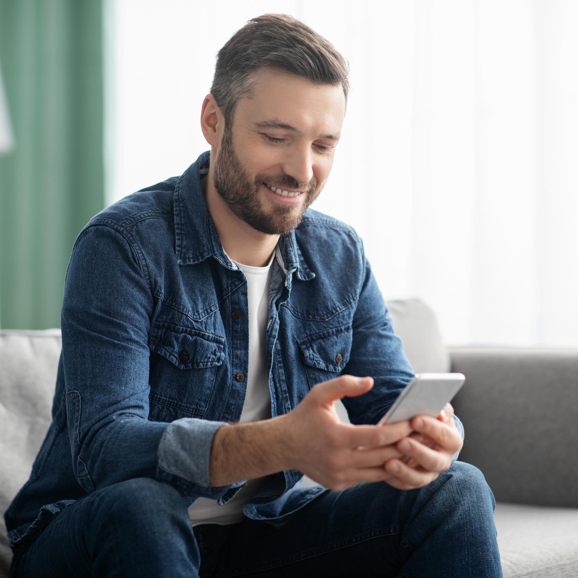 man looking at his phone