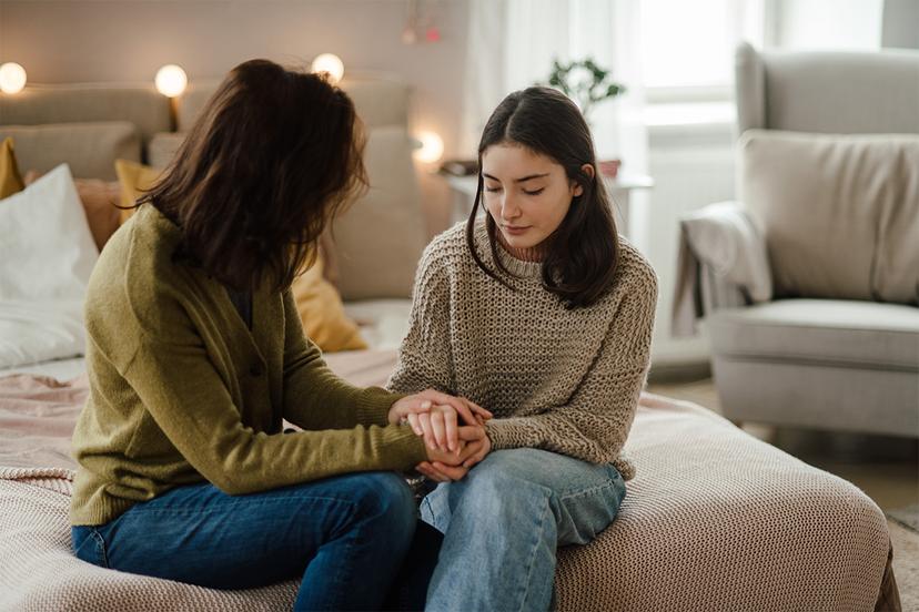Mother consoling teen daughter
