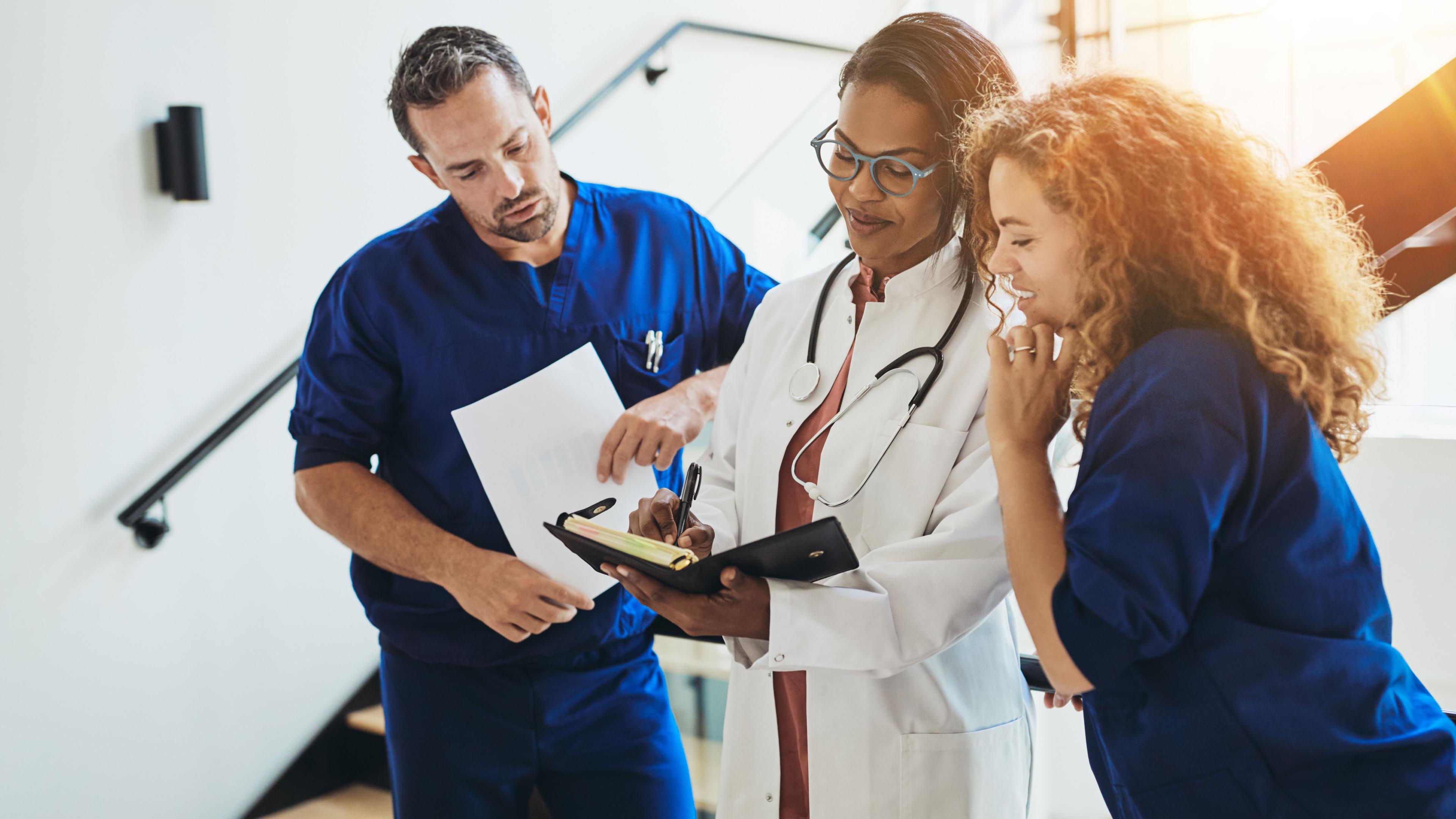 medical residents talking in hospital hallway