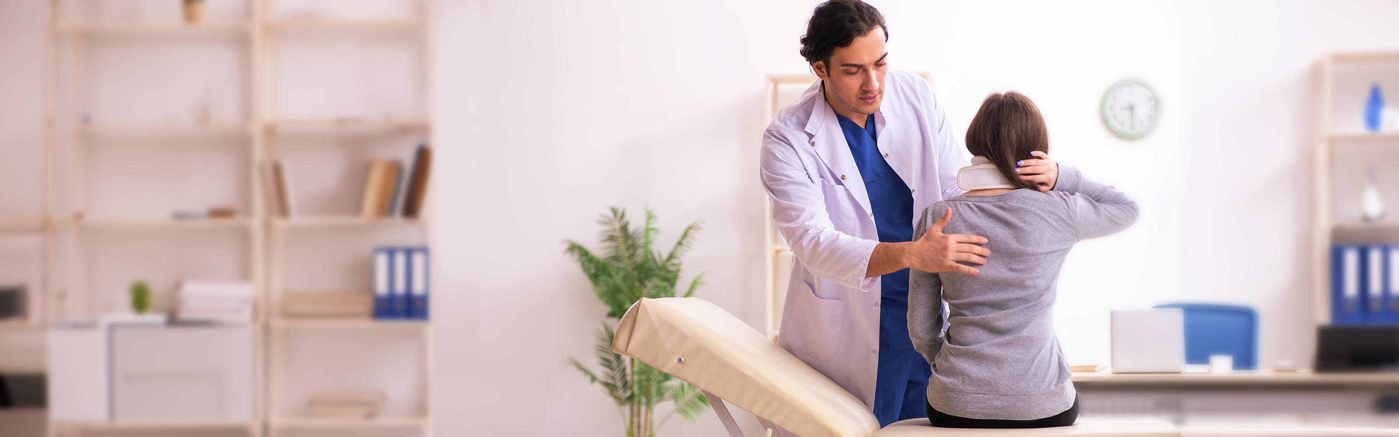 Spinal doctor examining patient