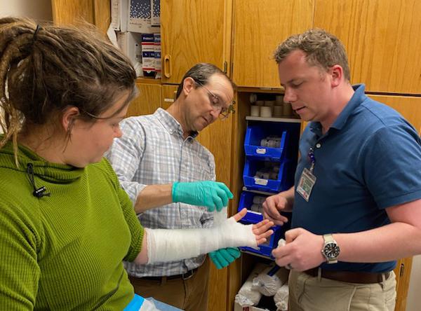 residents treating a patient in the family medicine clinic
