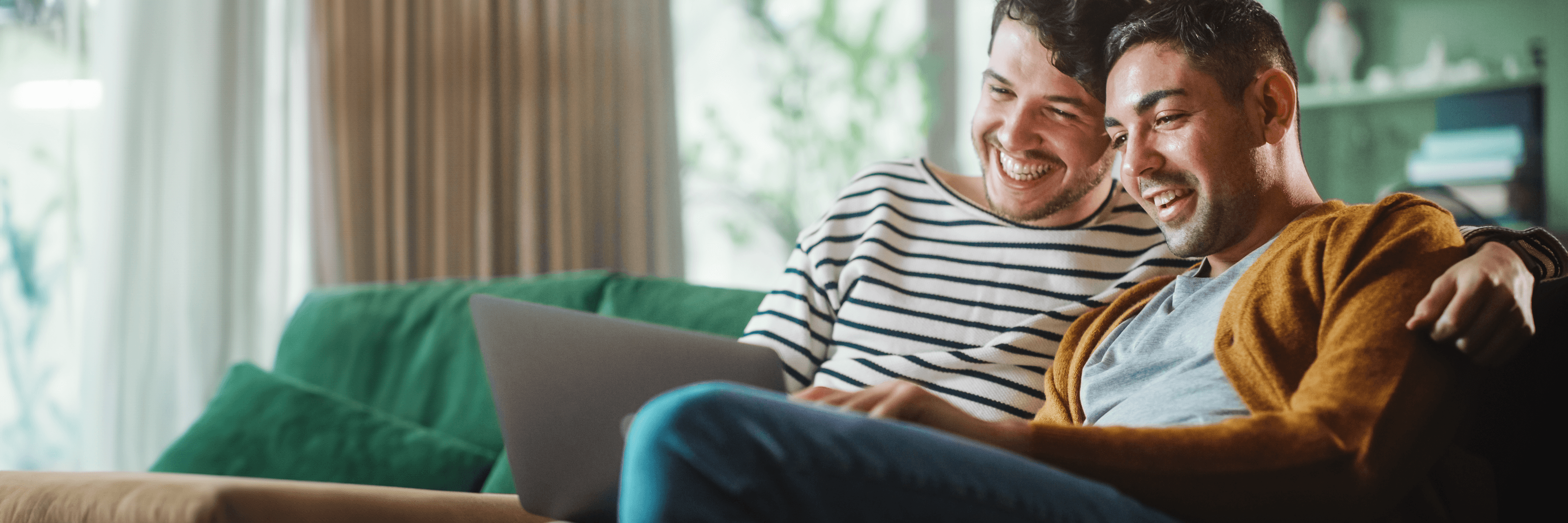 couple on couch with laptop