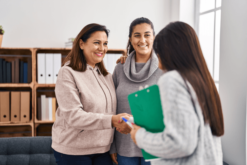patient shaking hands with provider
