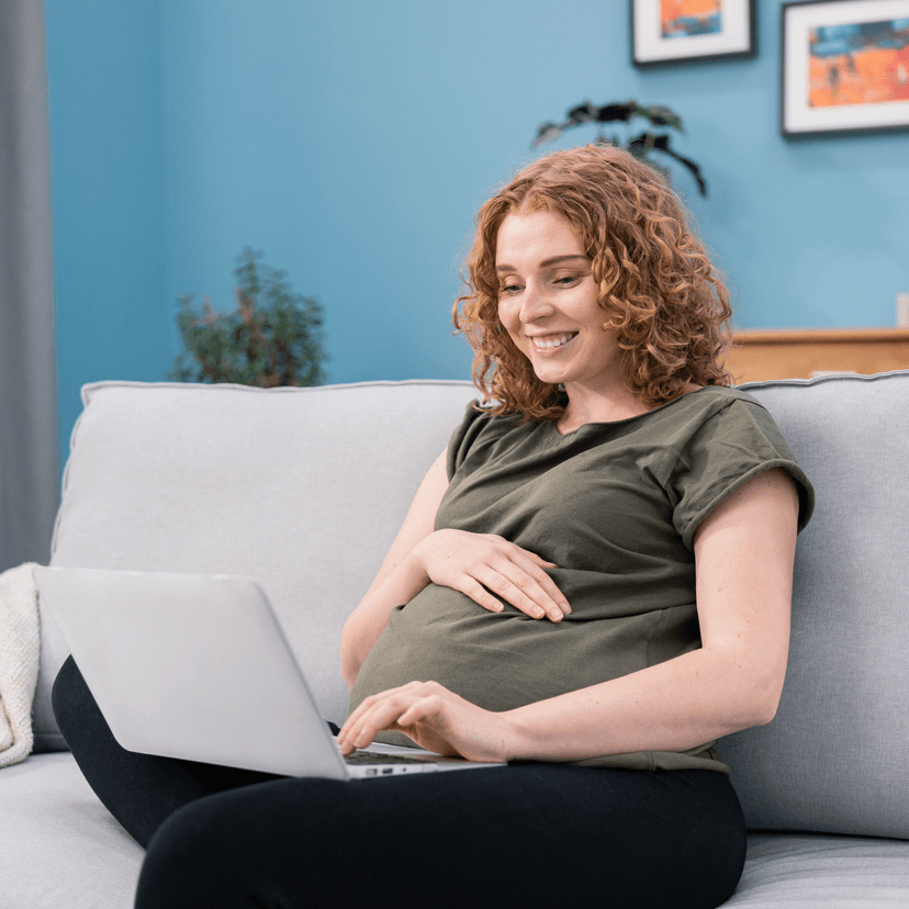 woman on couch with laptop