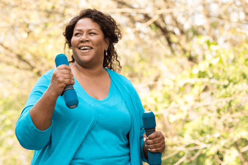woman walking with hand weights